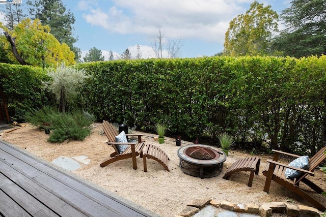 view of patio / terrace with an outdoor fire pit