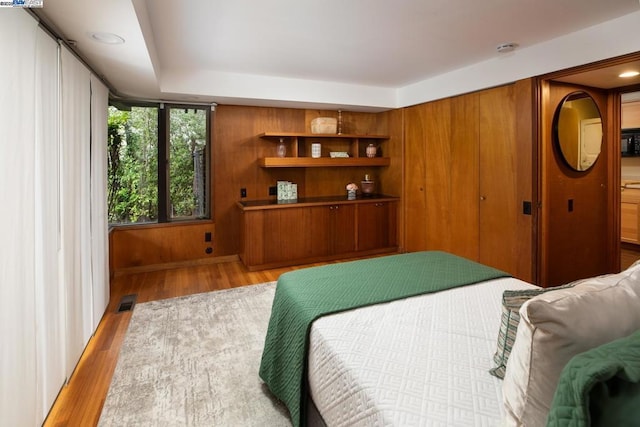 bedroom with light hardwood / wood-style flooring