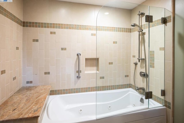 bathroom featuring tiled shower / bath