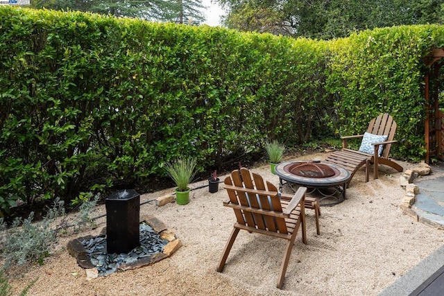 view of patio with an outdoor fire pit