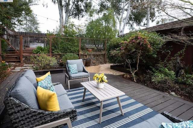 wooden deck with outdoor lounge area