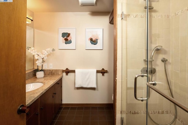 bathroom with walk in shower, tile patterned floors, and vanity