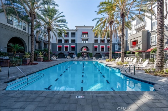 view of swimming pool with a patio area