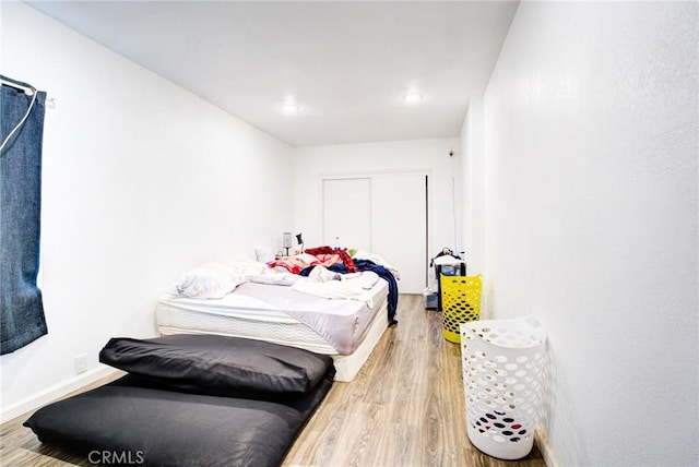 bedroom with light hardwood / wood-style floors