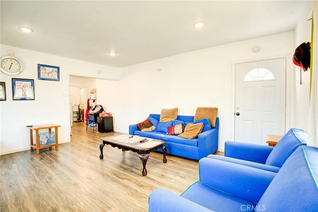 living room with light hardwood / wood-style flooring