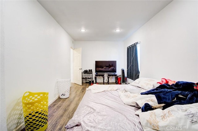 bedroom with wood-type flooring