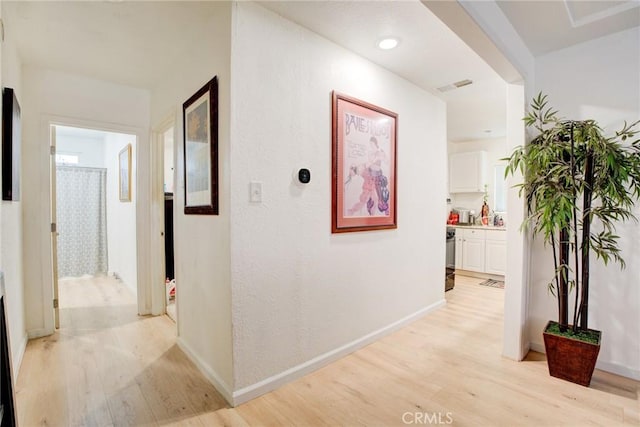 corridor featuring light hardwood / wood-style flooring