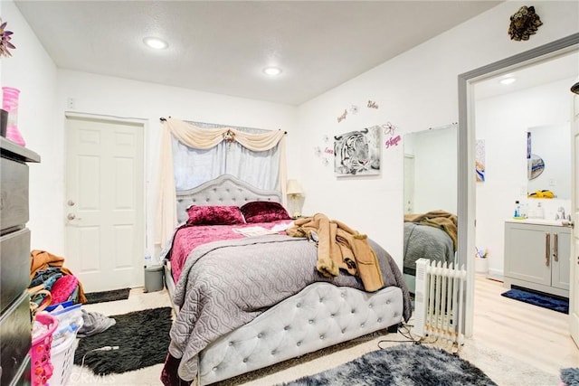 bedroom with light hardwood / wood-style floors