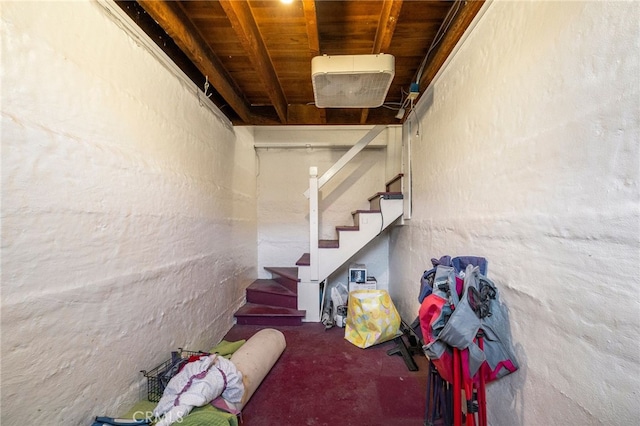 staircase featuring carpet