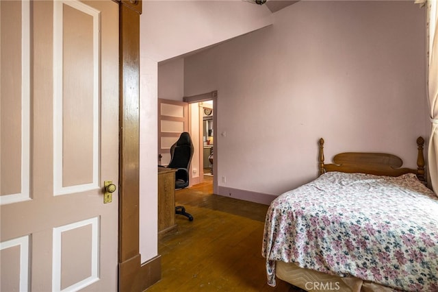 bedroom featuring dark wood-type flooring