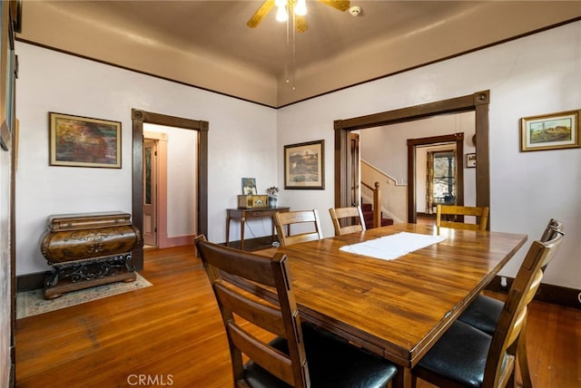 dining space featuring ceiling fan and hardwood / wood-style floors