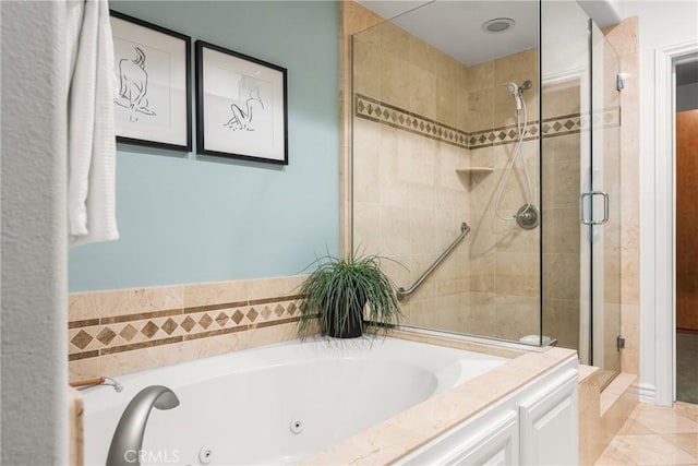 bathroom with tile patterned floors and shower with separate bathtub