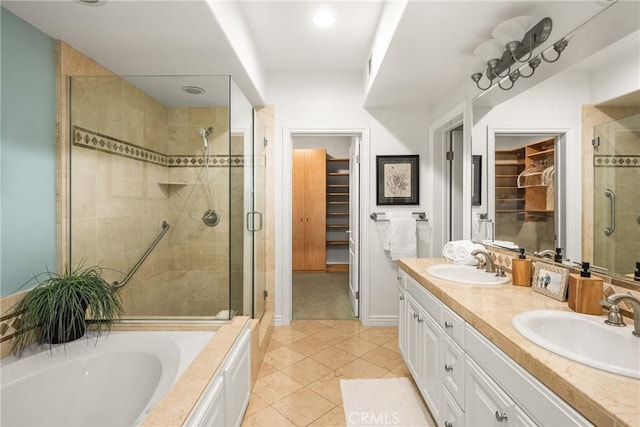 bathroom featuring vanity, tile patterned floors, and independent shower and bath