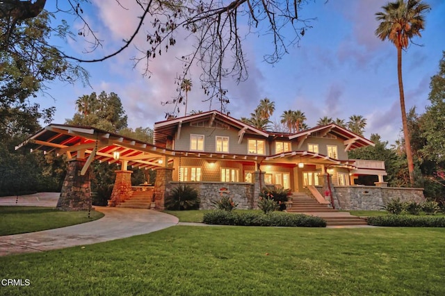 craftsman house with a yard