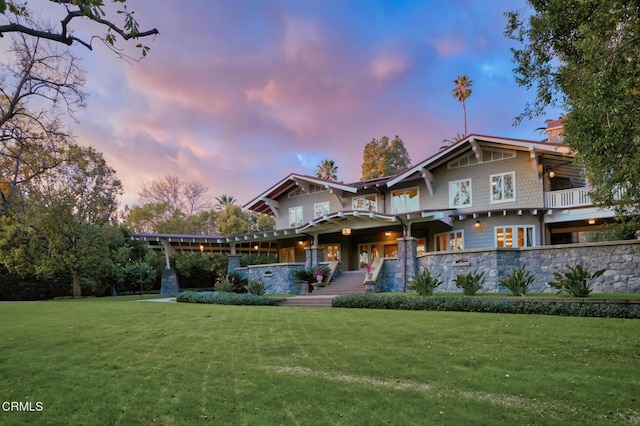 view of front of home with a lawn