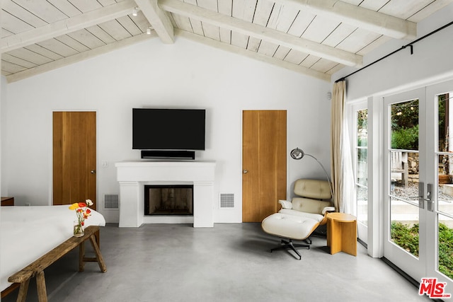 bedroom with lofted ceiling with beams, concrete floors, and wood ceiling