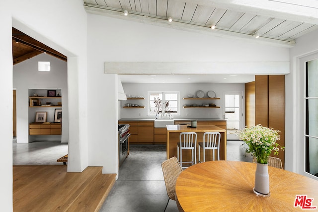 dining area featuring lofted ceiling and wood ceiling