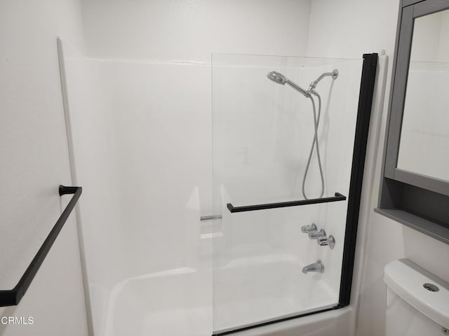 bathroom featuring shower / bathtub combination and toilet