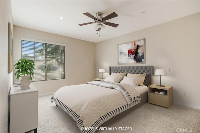 bedroom with ceiling fan and light colored carpet