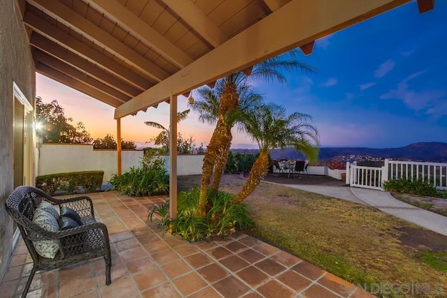 view of patio terrace at dusk