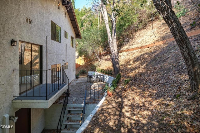 view of property exterior featuring a patio area