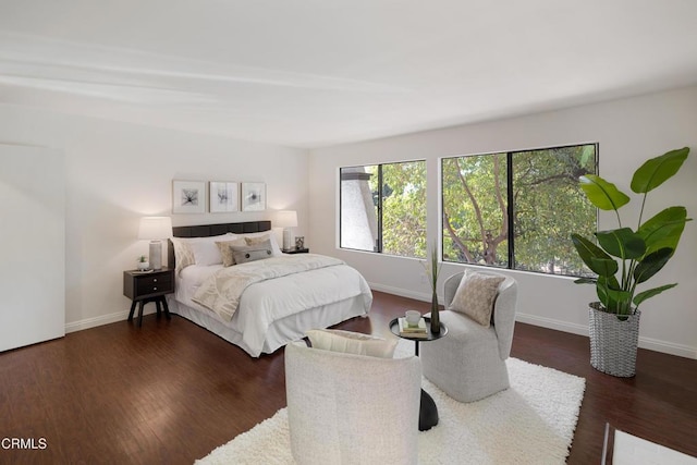 bedroom with dark wood-type flooring