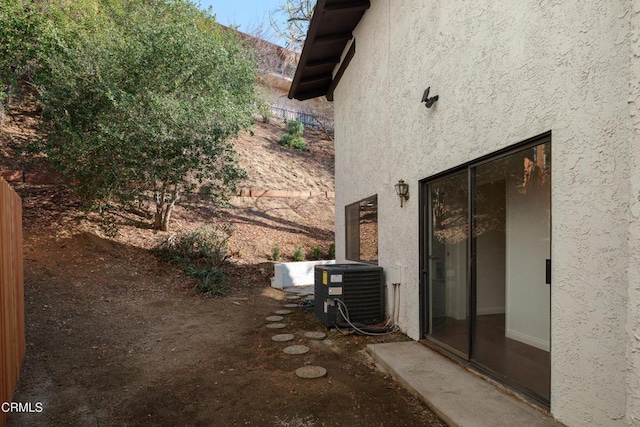 view of home's exterior with central AC unit