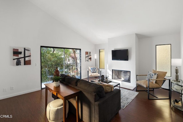 living room featuring high vaulted ceiling and dark hardwood / wood-style floors