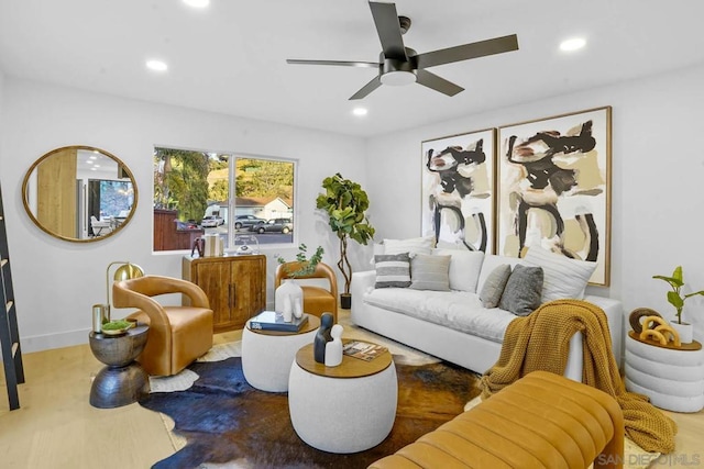 living room featuring hardwood / wood-style flooring and ceiling fan