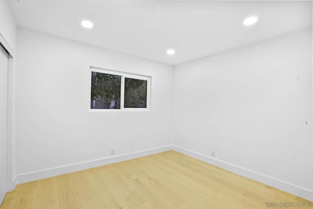 empty room with wood-type flooring