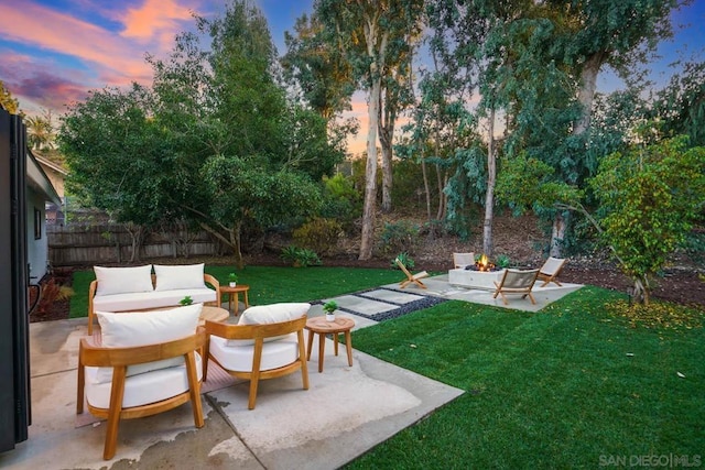 yard at dusk with a patio