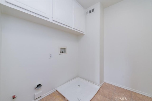 laundry room featuring hookup for a washing machine and cabinets