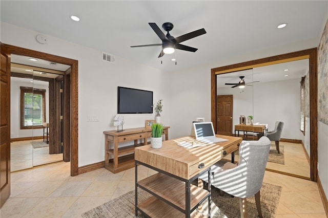 dining space with ceiling fan and light tile patterned floors