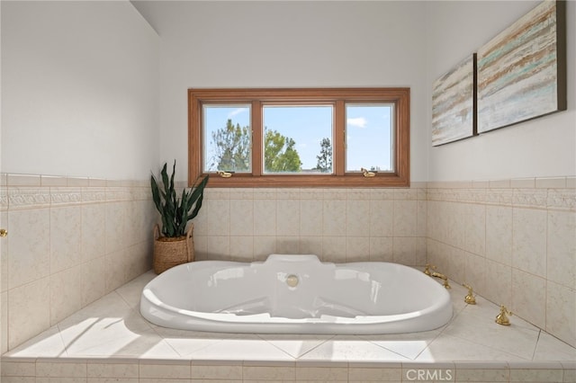 bathroom featuring a relaxing tiled tub