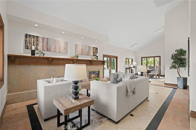 living room featuring high vaulted ceiling