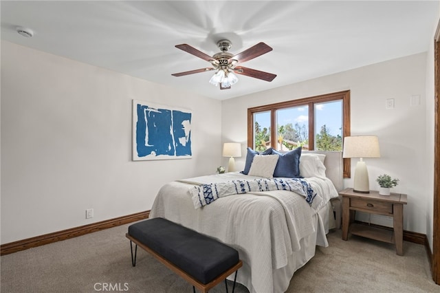 bedroom featuring light carpet and ceiling fan