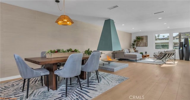 dining space featuring light hardwood / wood-style floors