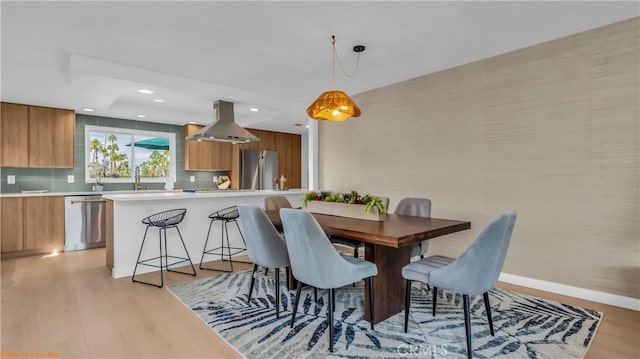 dining space featuring light hardwood / wood-style flooring