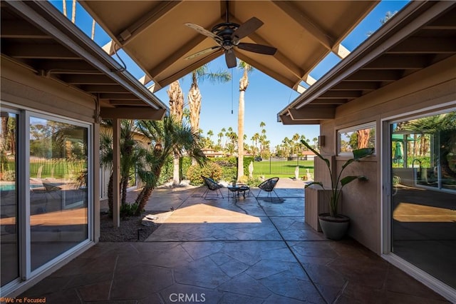 view of patio featuring ceiling fan