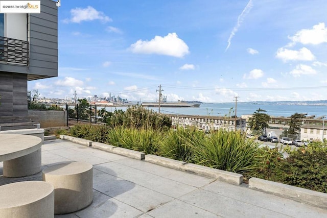 view of patio / terrace with a water view