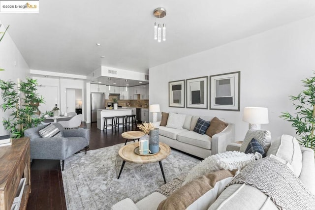 living room featuring dark wood-type flooring