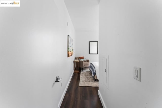 corridor with dark wood-type flooring