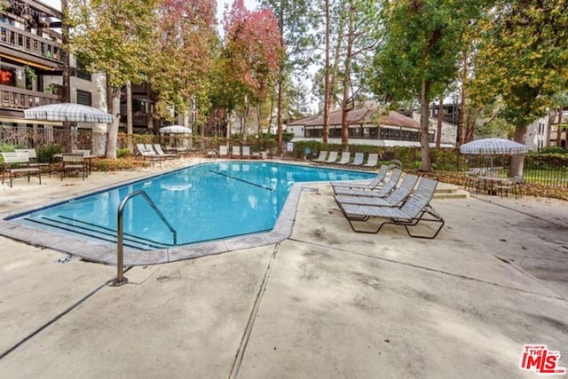 view of swimming pool featuring a patio