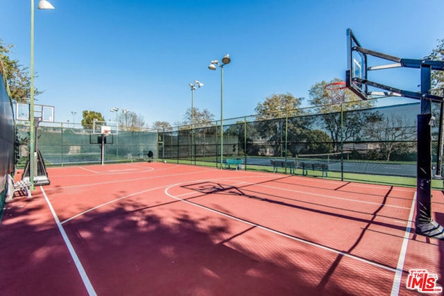 view of basketball court with tennis court