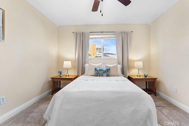 carpeted bedroom featuring crown molding and ceiling fan