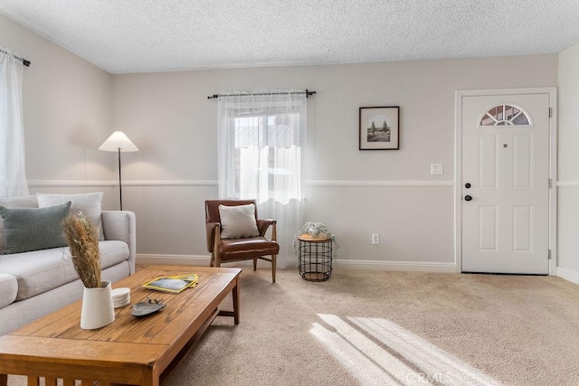 carpeted living room with a textured ceiling