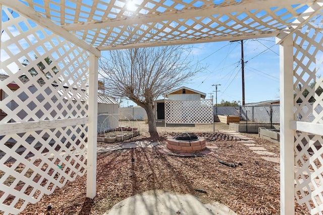 view of yard with a fire pit