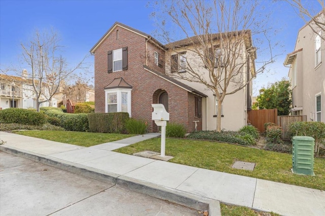 view of front of home featuring a front lawn