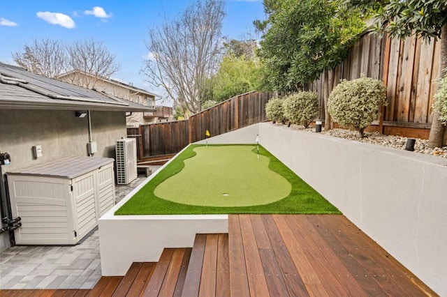 view of yard featuring a wooden deck and cooling unit