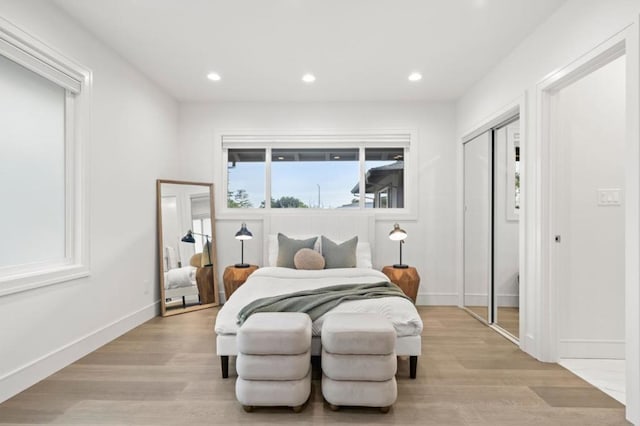 bedroom with light hardwood / wood-style floors